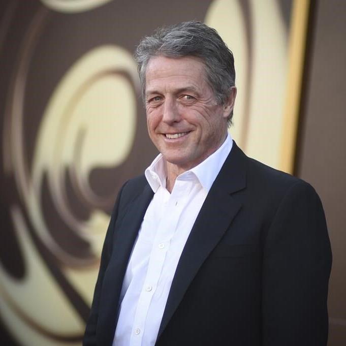 Hugh Grant says he took 'enormous sum' to settle suit alleging illegal snooping by The Sun tabloid